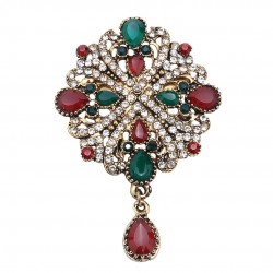 Gold color crystal stony motif brooch